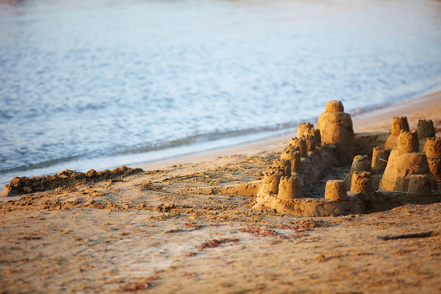 Sand castle on the beach at sunset